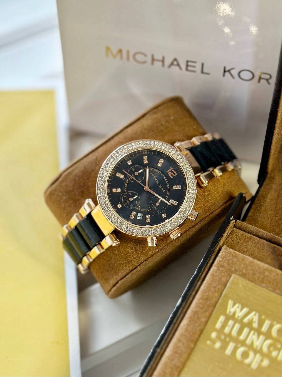 Michael Kors For Her Black  Perfectly made for outgoing and active ladies, this Michael Kors modern and stylish watch would be a great accessory for you.